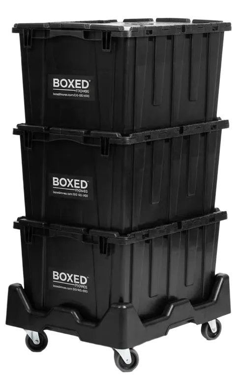 Three Boxed Moves plastic moving boxes stacked on a rolling dolly